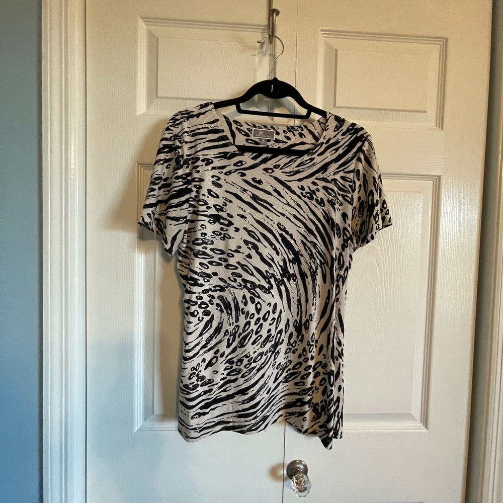 Dressy blouse with a silky feeling.  Not see thru.  Long length.